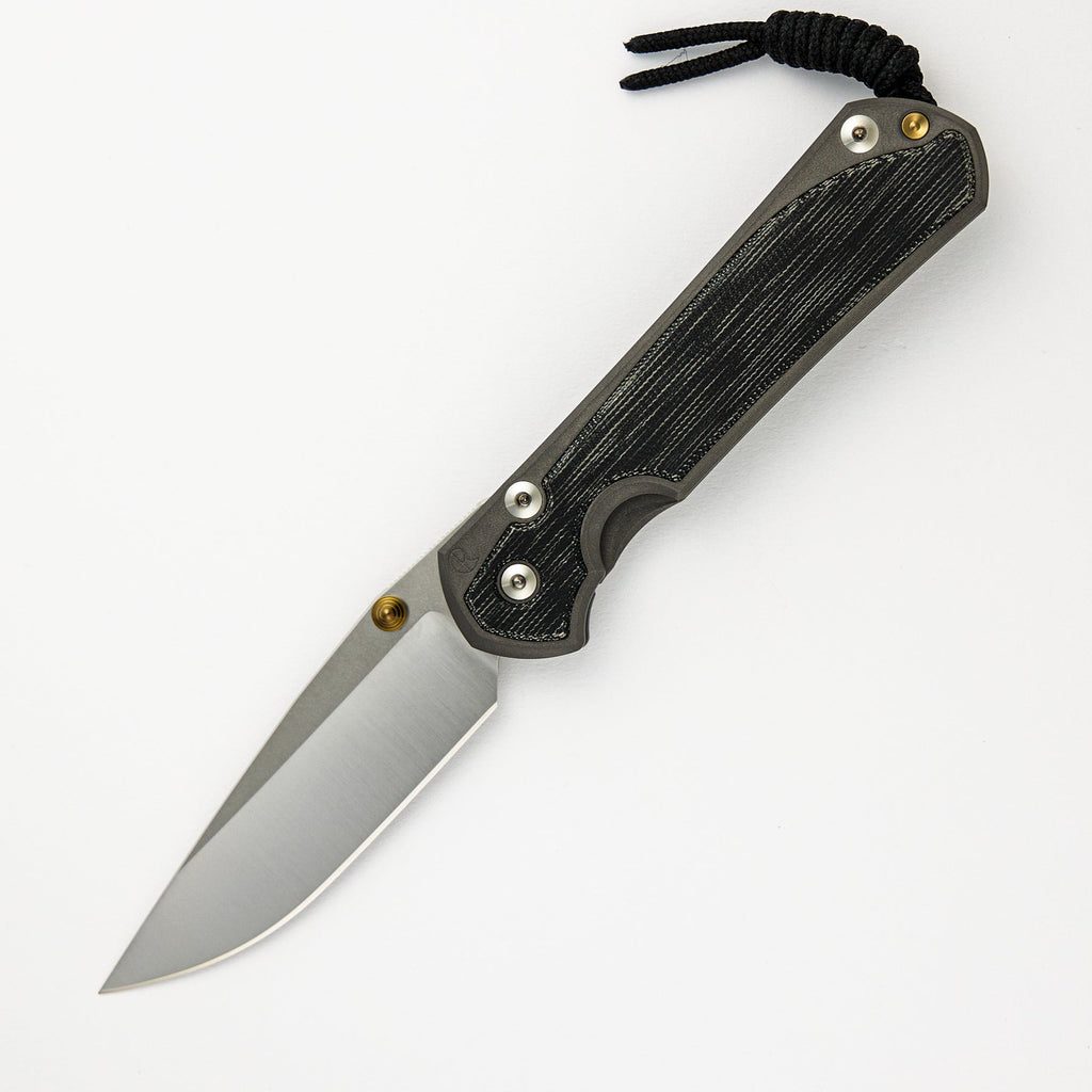 LARGE SEBENZA 31 BLACK CANVAS MICARTA INLAY – POLISHED CPM MAGNACUT BLADE – GOLD DOUBLE THUMB LUGS