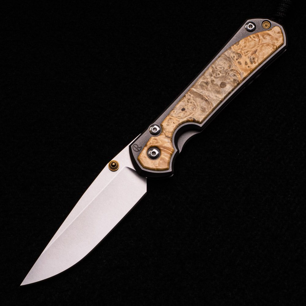 LARGE SEBENZA 31 BOX ELDER BURL INLAY – CPM MAGNACUT BLADE – GOLD DOUBLE THUMB LUGS