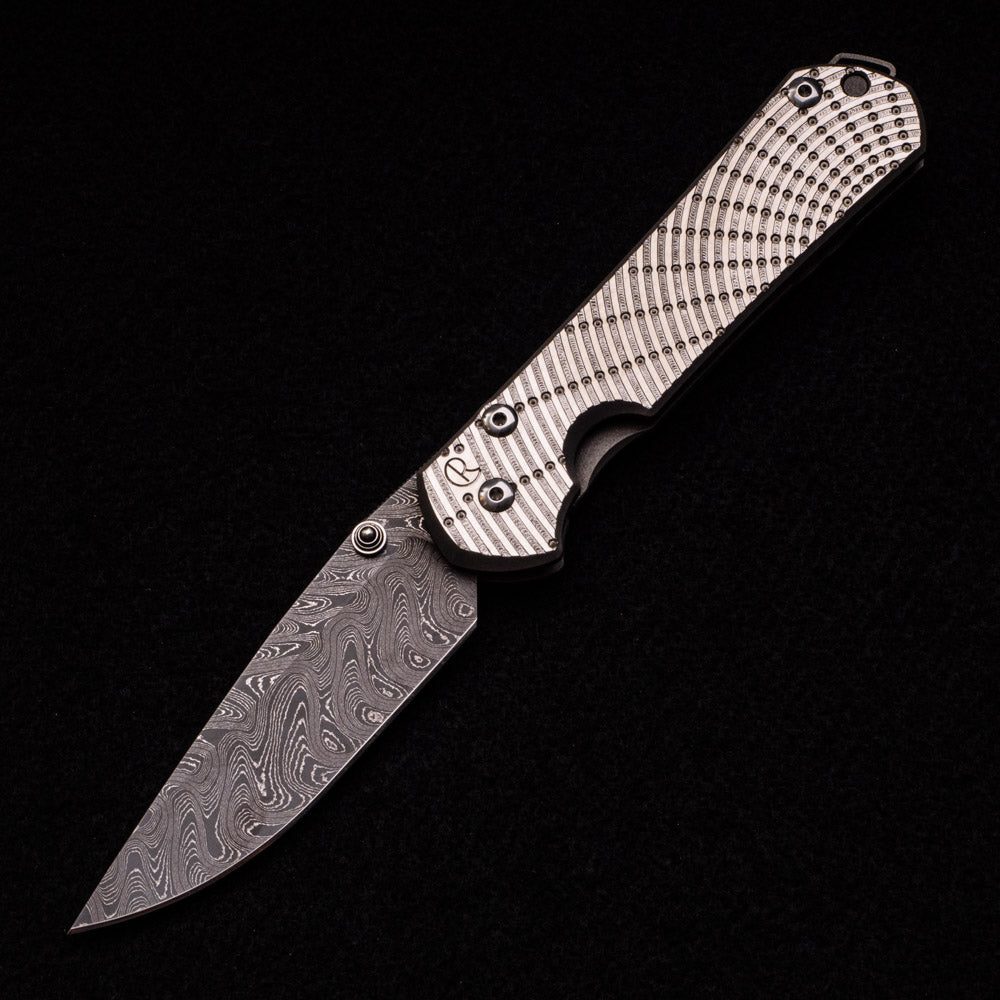 LARGE SEBENZA 31 UNIQUE GRAPHIC – BOOMERANG BLADE – DOUBLE SILVER LUGS