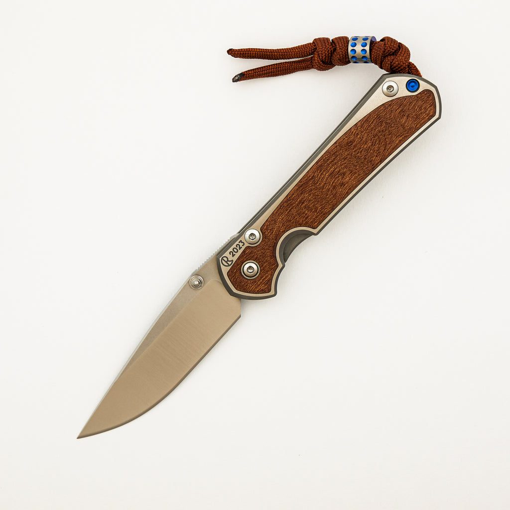 Small Sebenza 31 Annual 2023 - Sapele Mahogany Inlay - Polished Drop Point CPM MagnaCut Blade - Silver Single Thumb Lug